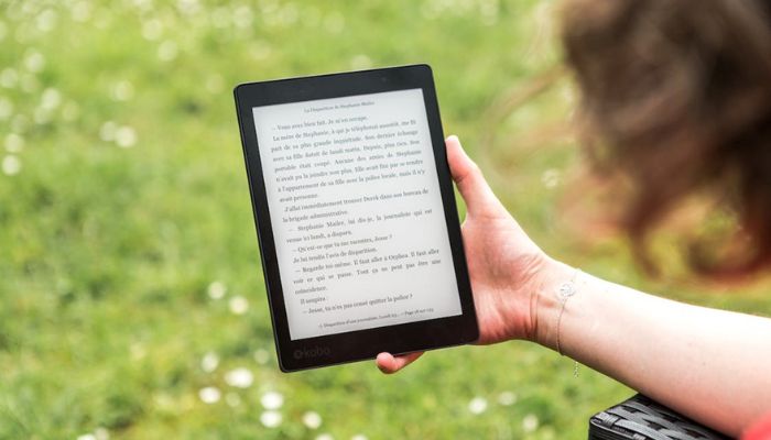 Image of the person reading through an E-book —Pexels.