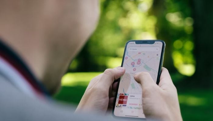 A person using a mobile app as a map.— Unsplash