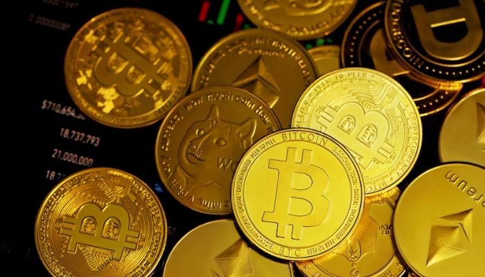 Multiple crypto coins in the dark. — Unsplash