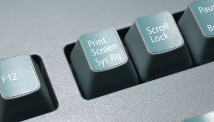 An undated image illustrating the Print Screen button that takes screenshot on Windows — Canva