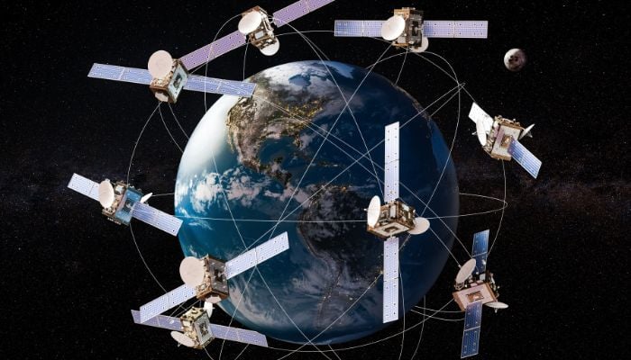 A representative image illustrating space satellites in orbits around the Earth globe. — Canva
