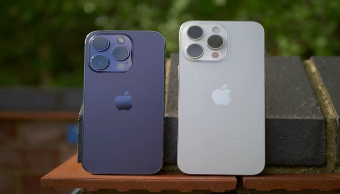 The image displays the iPhone 14 Pro and iPhone 15 Pro. — Canva