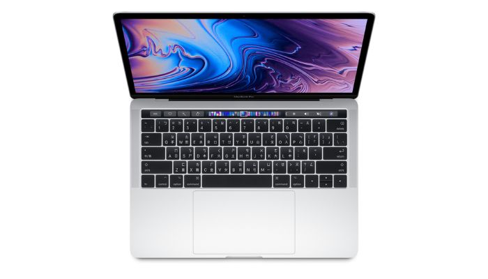 The image shows a Macbook Pro 13. — Apple