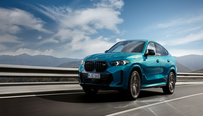 An undated image shows the BMW X6 40i driving on the road. — BMW