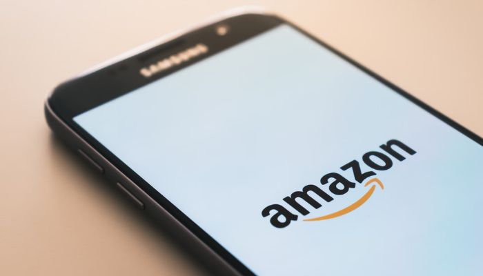 The image shows the Amazon logo on Samsung screen. — Unsplash