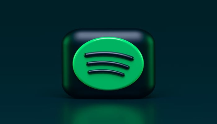 A representational image displays the logo of Spotify. — Unsplash