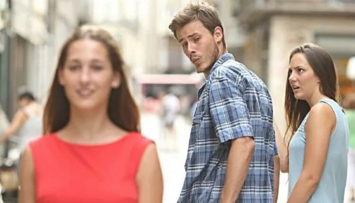 The image of a man whistling at another woman while holding hands with his girlfriend which went viral in 2017 is popularly known as the distracted boyfriend meme. — X/@_conradslee