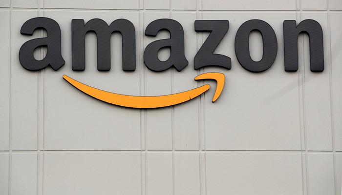 The Amazon logo is pictured outside the companys JFK8 distribution center in Staten Island, New York, U.S. November 25, 2020. — Reuters