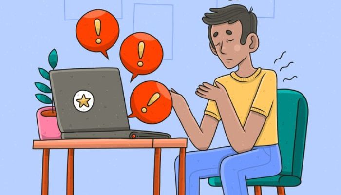 The image is of an animated man sitting in front of a laptop. — Freepik