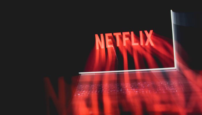 The image shows the Netflix logo. — Unsplash