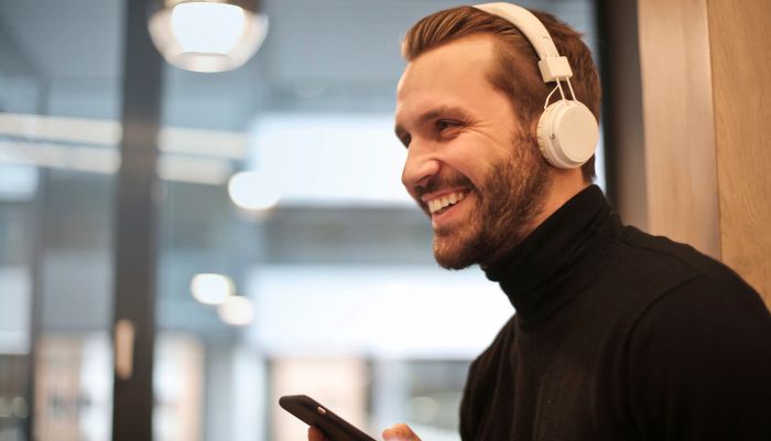 An undated image illustrating a person wearing a headphone. — Canva
