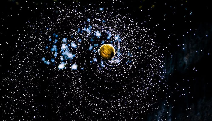 An undated image illustrates revolving planets. — Unsplash