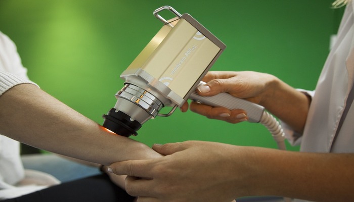 A representational image shows a doctor treating a patient with laser technology. — Pixabay
