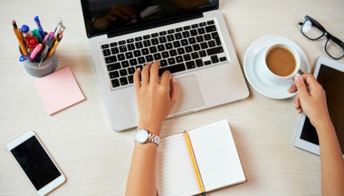 An undated image illustrating a person using laptop. — Canva