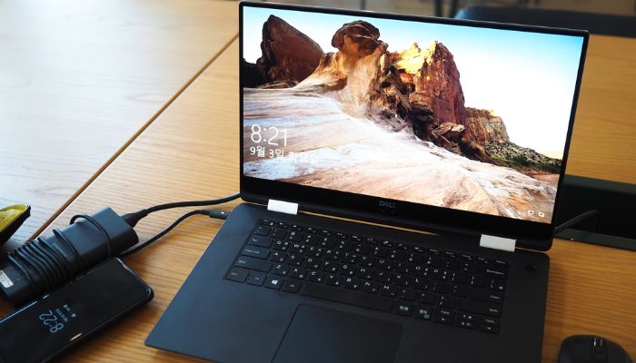 The image shows a Dell laptop. — Unsplash
