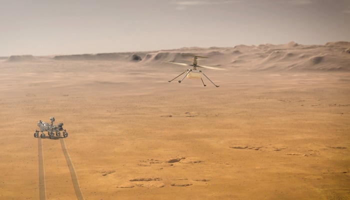 Ingenuity Mars Helicopter attempts its first test flight on Mars near NASAs Perseverance Mars rover in an undated illustration provided by Jet Propulsion Laboratory in Pasadena, California. — Reuters