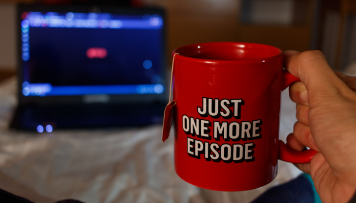 An undated image illustrating a person watching a series. — Canva
