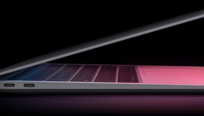 The image shows a Macbook Air. — Apple