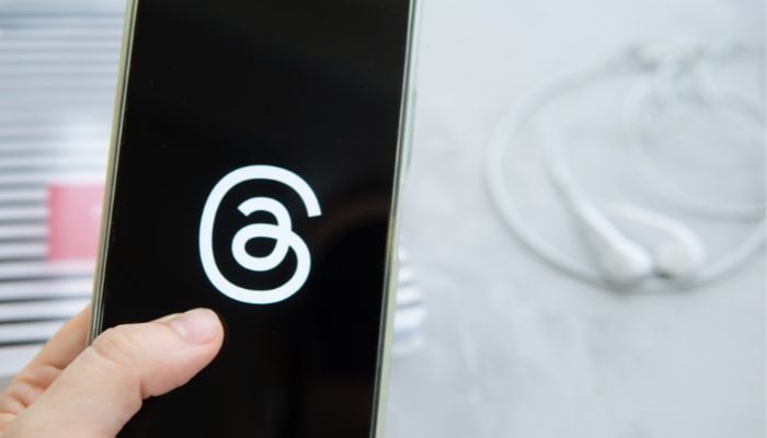 An undated image illustrating the Threads logo. — Canva
