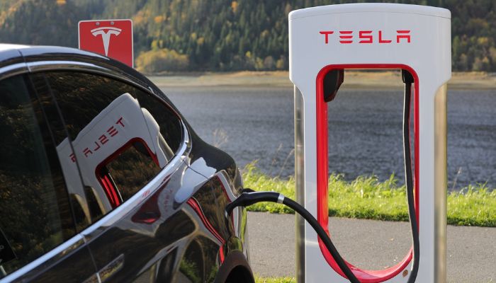 An undated image of a Tesla vehicle being charged. — Canva