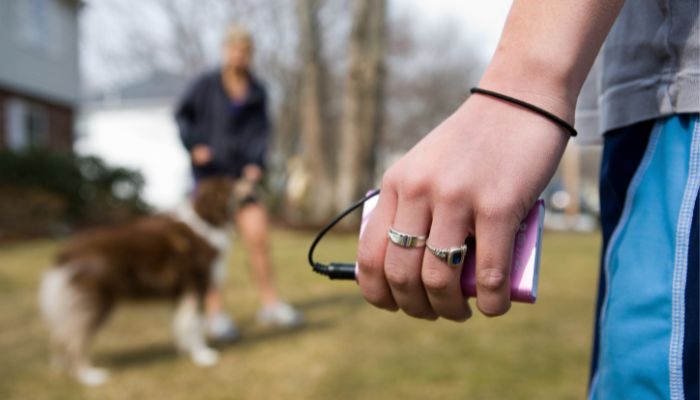 An undated image showing a person holding an MP3 Player. — Canva