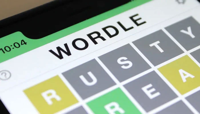 A Wordle puzzle is displayed on a phone. — Polygon