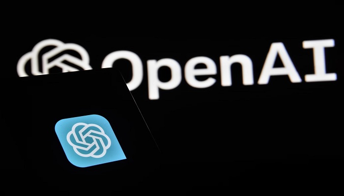 The image shows Open AI written on a black canvas. — Unsplash