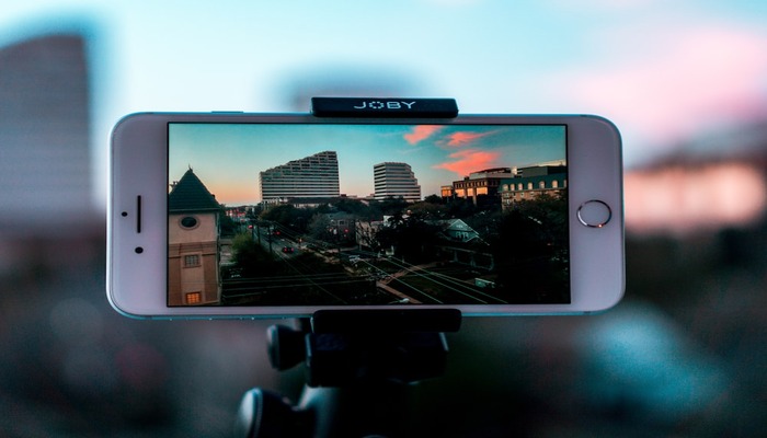 An undated image shows an street on an iPhone screen. — Unsplash