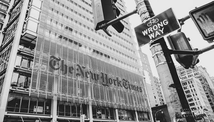 The image shows the New York Times building. — Unsplash