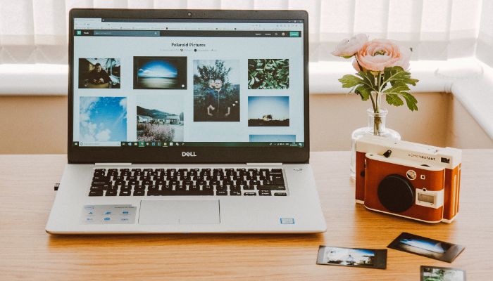 A representational image of Dell laptop placed on a table. — Canva