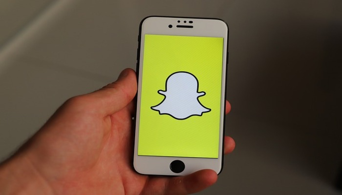 The image shows Snapchat logo on a mobile screen. — Pixabay