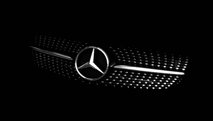 The image displays Mercedes logo. — Unsplash