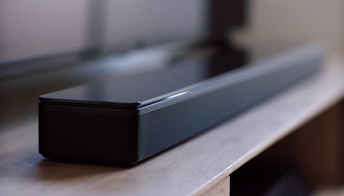 The image shows a Bose soundbar. — Bose
