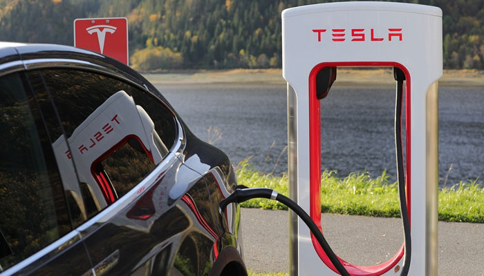 An undated image of a Tesla vehicle charging from its service station. — Pixabay
