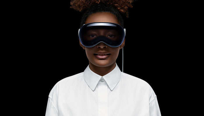 An undated image of a girl wearing an Apple Vision Pro. — Apple