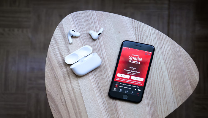 The image displays Spatial Audio app on a mobile screen. — Unsplash