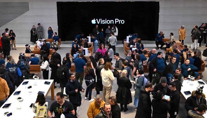 Customers attend the product launch for the Apple Vision Pro headset at the Apple Store in New York City on February 2, 2024. — AFP