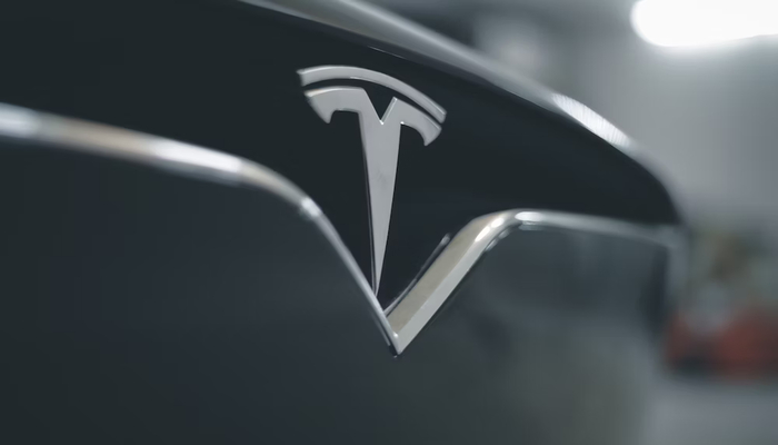 An undated image displays Tesla logo. — Unsplash
