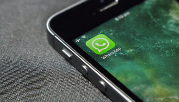 An undated image of the WhatsApp icon on a mobile phone. — Canva