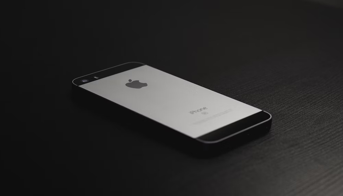 An undated image displaying an iPhone SE. — Unsplash