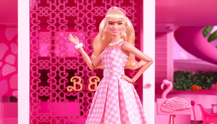 The image shows Barbie waving. — Mattel Creations
