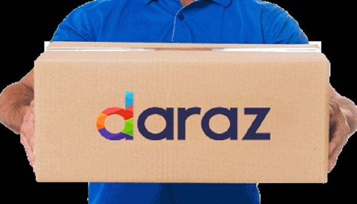 The image shows a person holding a box that says Daraz. — Daraz