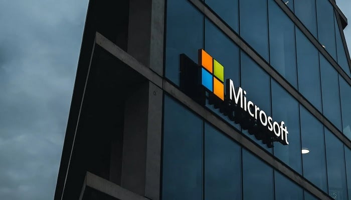 The image shows the glass panel exteriors of the Microsoft building. — Pexels