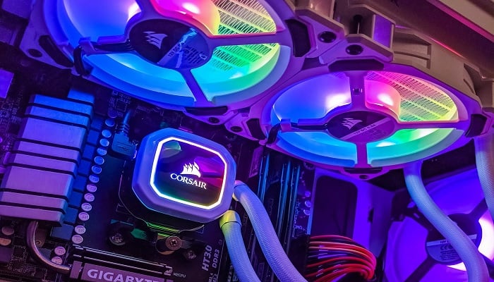 The image shows a CPU cooler and a white Corsair case. — Unsplash