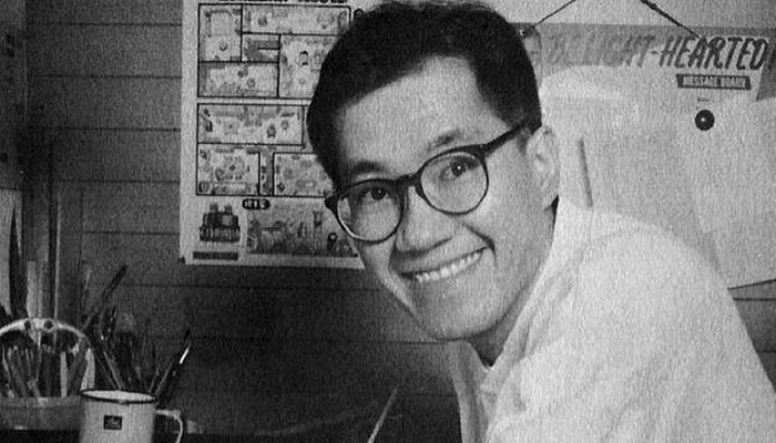The image shows a black and white photo of the renowned manga artist and creator of the iconic Dragon Ball series, Akira Toriyama. — IGN
