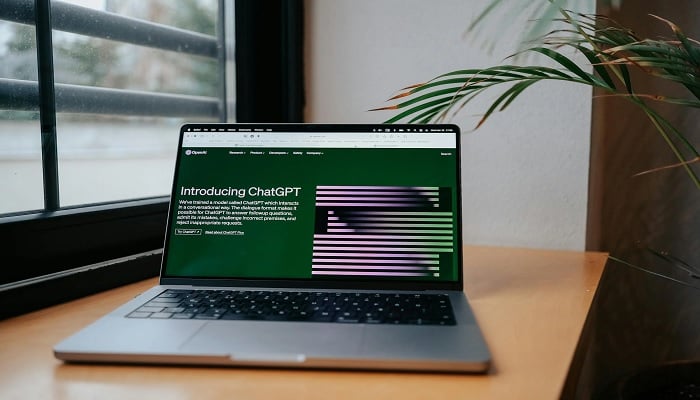 The image shows ChatGPT open on a laptop. — Pexels