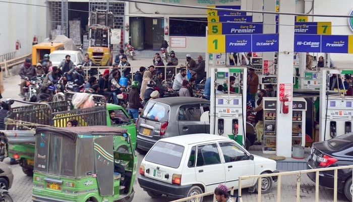 An undated image of cars lined up at a petrol pump. — Online