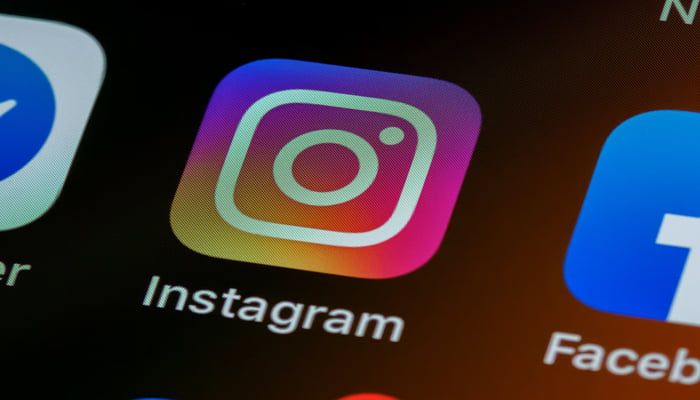 An undated image of Instagram logo displayed on a mobile screen. —Unsplash