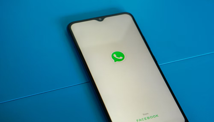 An undated image displays WhatsApp on a mobile screen. — Unsplash
