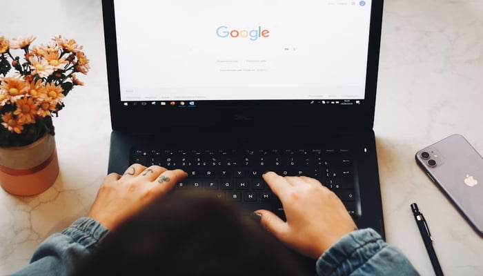 An undated image showing a man using Google Chrome. — Unsplash